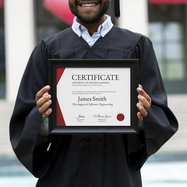 man holding his graduation certificate