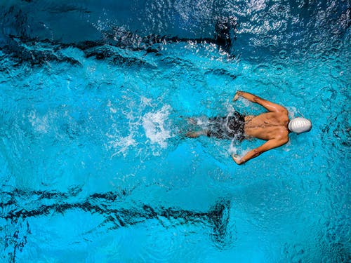 Swimming By A Man