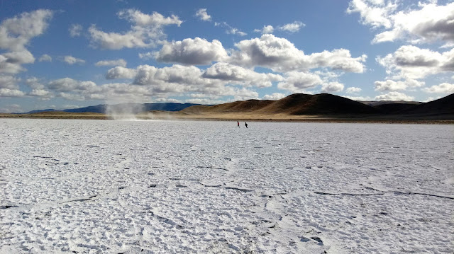 photograph of the boys on Soda Lake with a little whirlwind of minerals in the background