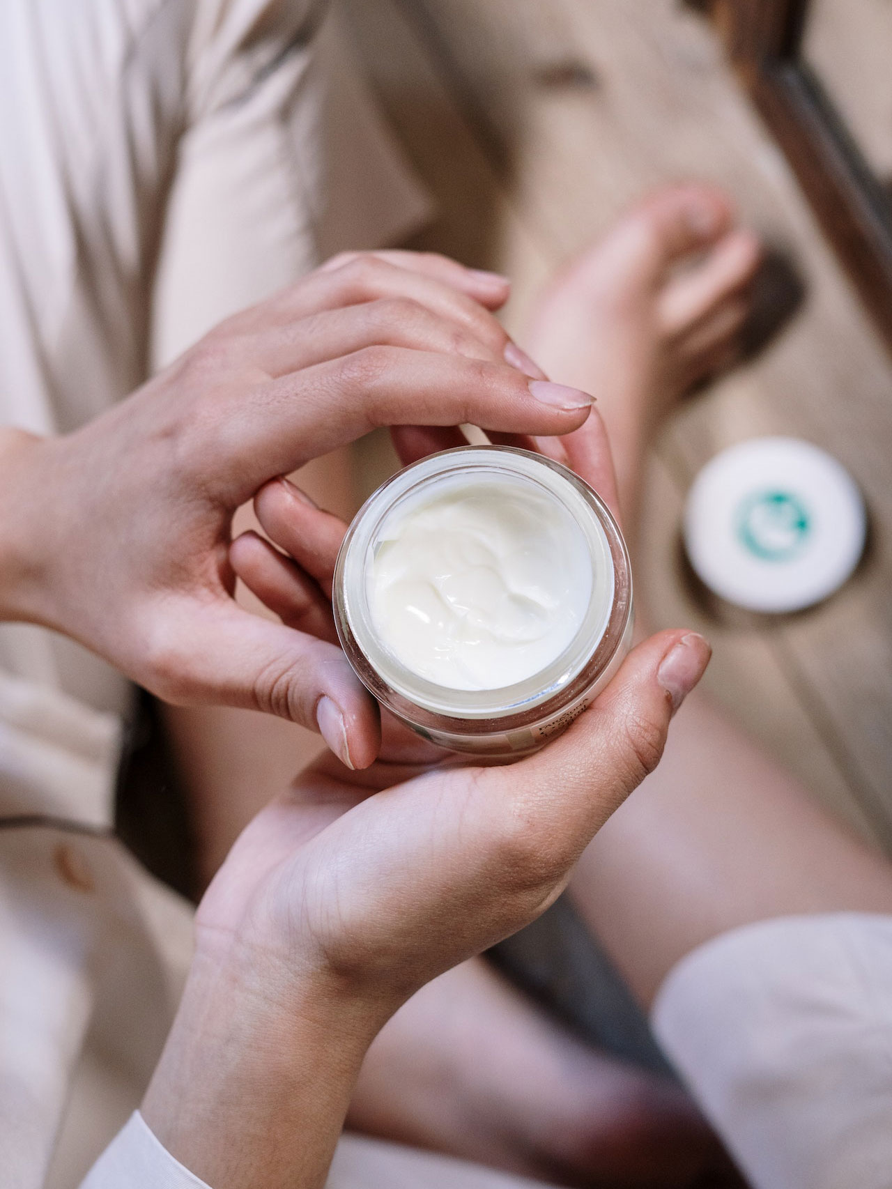 Lady applying face cream