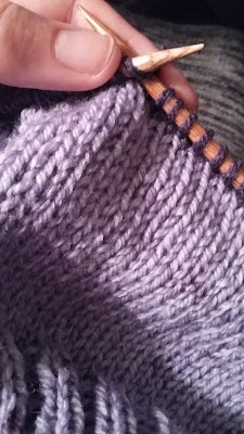 knitting a purple slouchy hat with Caron Cakes yarn