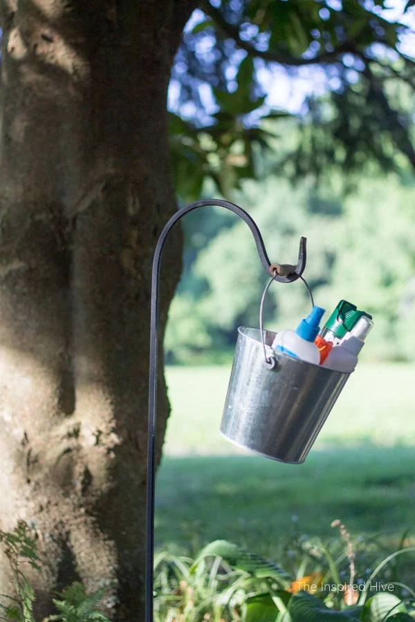 Great idea! Keep bug spray in a bucket and hang on a garden hook. Perfect for outdoor parties. 