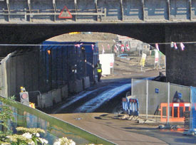 Marshgate Lane (with pelican crossing in the shadows beneath the railway arch)