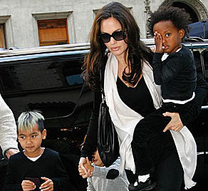 Angelina Jolie in scarf with kid in tow