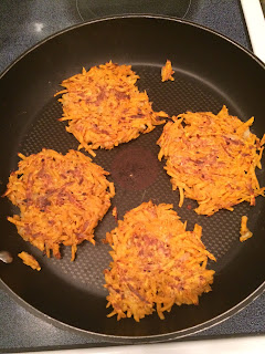 frying pan with sweet potato pancakes cooking 