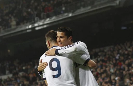 Cristiano Ronaldo celebrates his goal against Celta with Real Madrid teammate Karim Benzema