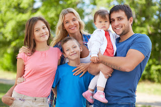 A family standing at his farm at Saskatchewan