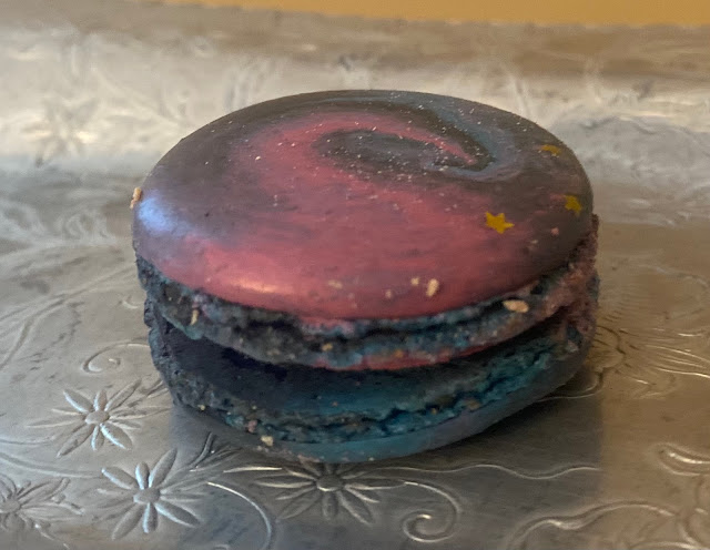 picture of a galaxy macaron on a silver plate