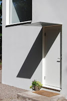 Compact Casual White Cube House Design Simple and Ideal for Young Families