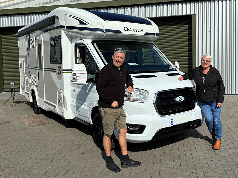 Couple standing next to Chausson 640 Motorhome