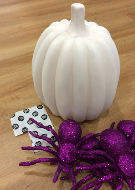 I used items from the dollar store to decorate ceramic pumpkins three different ways for Halloween.