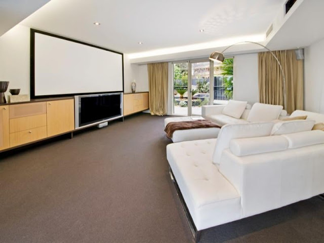 Incredible home theater with white large sofa