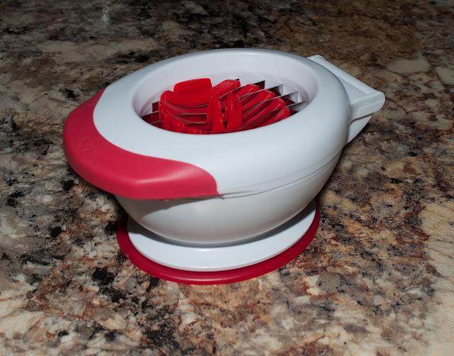 A small gadget used for slicing strawberries without a lot of fuss.