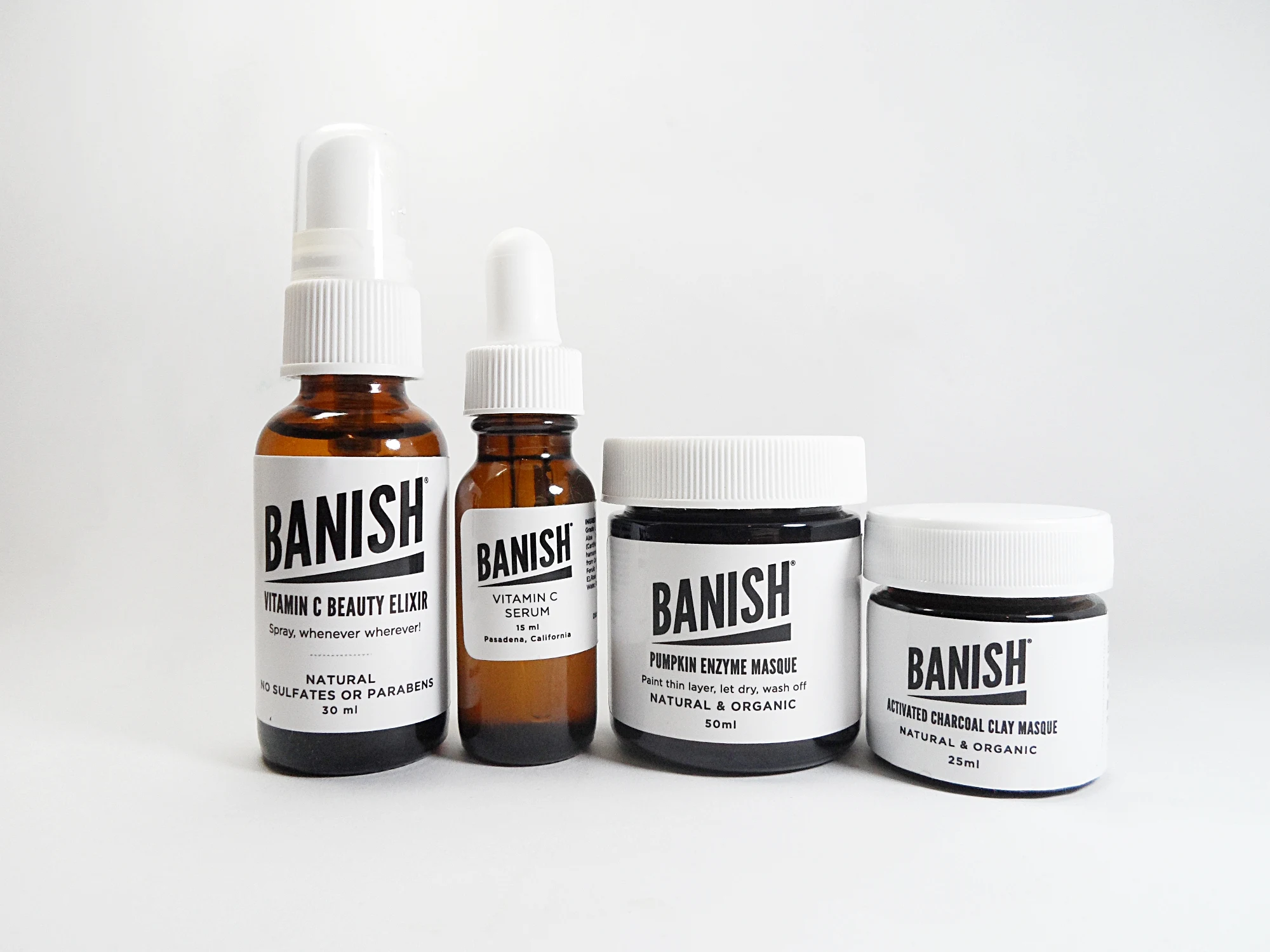 various skincare products by brand Banish on a white studio background