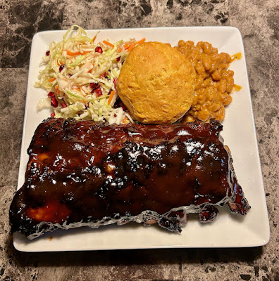 Bourbon glazed barbecued baby back ribs, mustard baked beans and cole slaw made with pomegranate, honey, olive oil and sage blossom vinegar