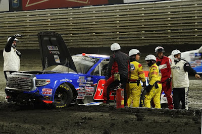 Jessica Friesen, driver of the No. 62 Halmar International Toyota, is helped by race crews.