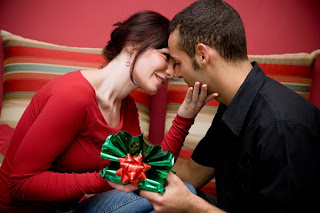 couple giving christmas gifts