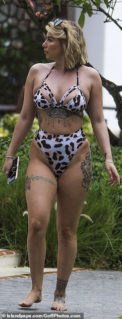 Olivia Buckland flaunts in a leopard print bikini in Barbados