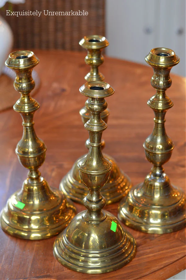 Large Brass Candlesticks on a table