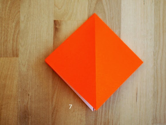 step 7 showing how to fold an origami pumpkin