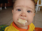 Baby eating slice of bread. I like bread!