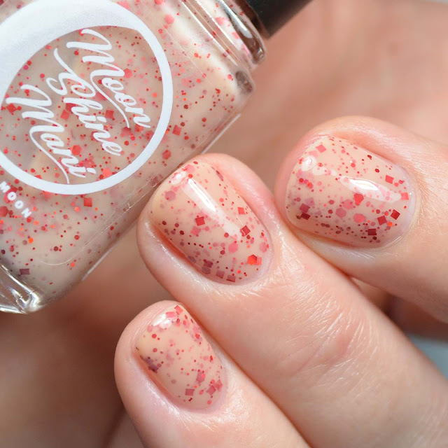 peach nail polish with holographic red glitter