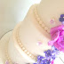 Royal purple  roses and Purple hydrangeas wedding cake with a Disney twist. 