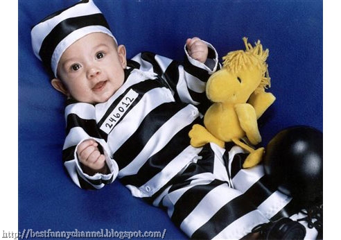 Funny baby in costume a prisoner.