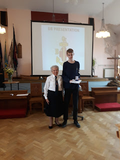 A member of the 10th Sheffield Boys' Brigade receiving his President's Badge in April 2023, with the Company Captain