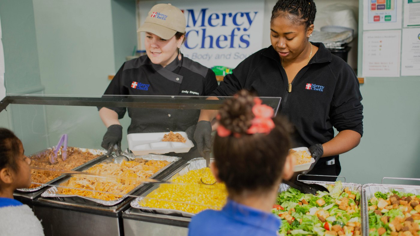 chefs serving food