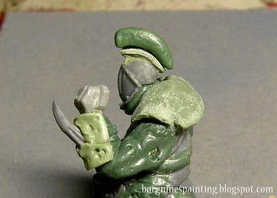 The remaining piece of metal has now a rough blob of greenstuff placed onto it.
