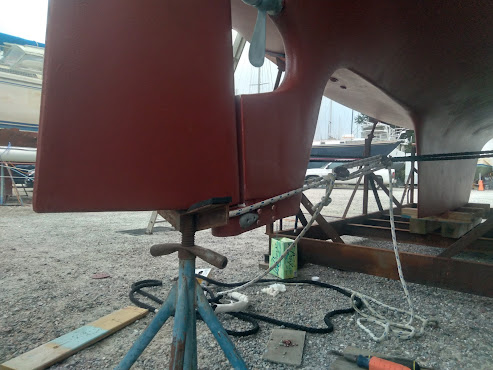 A freshly painted red rudder