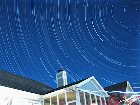 Star trails over house