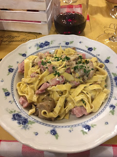 Homemade pasta with wild mushrooms and speck, a regional dish in Narni, Umbria, Italy along the ancient Roman road the Via Flaminia