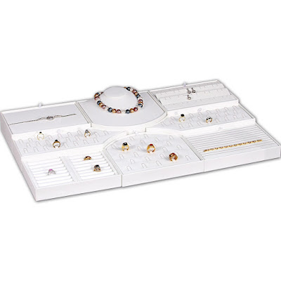 Use the white faux leather combination jewelry display perfectly fit in a glass table display.