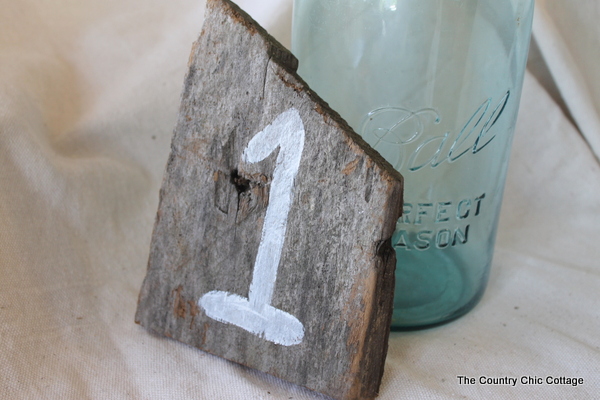 barn wood wedding reception table numbers What a great rustic touch to your
