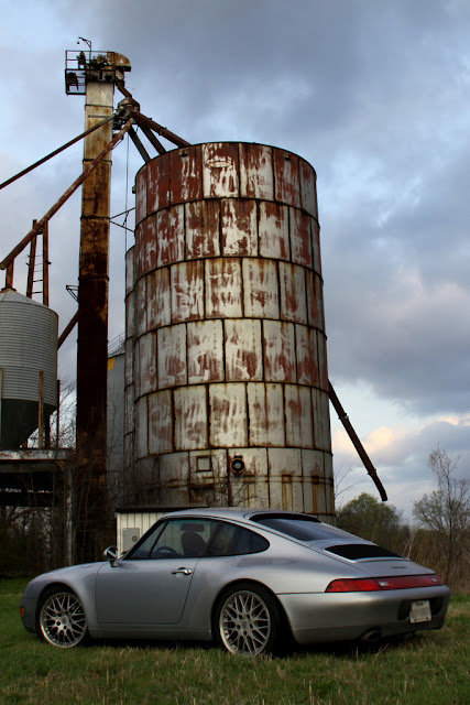 Silver Porsche 993 and a rusty silo, Clarksville TX