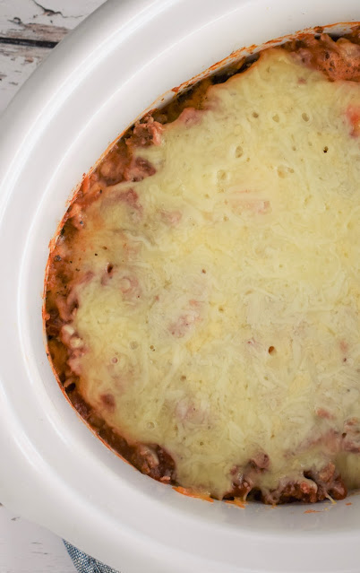Slow Cooker Lazy Lasagna in a white slow cooker.