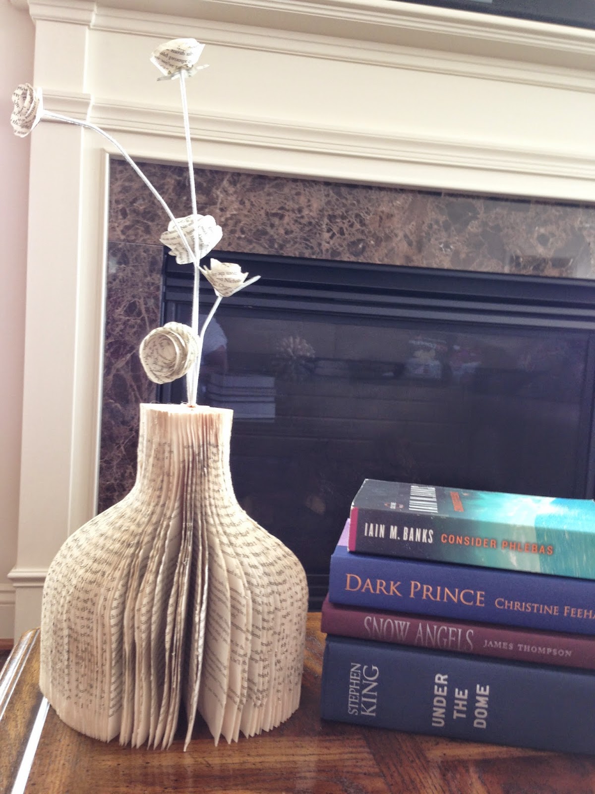 http://plumperfectandme.blogspot.com/2014/07/how-to-cut-book-into-vase.html