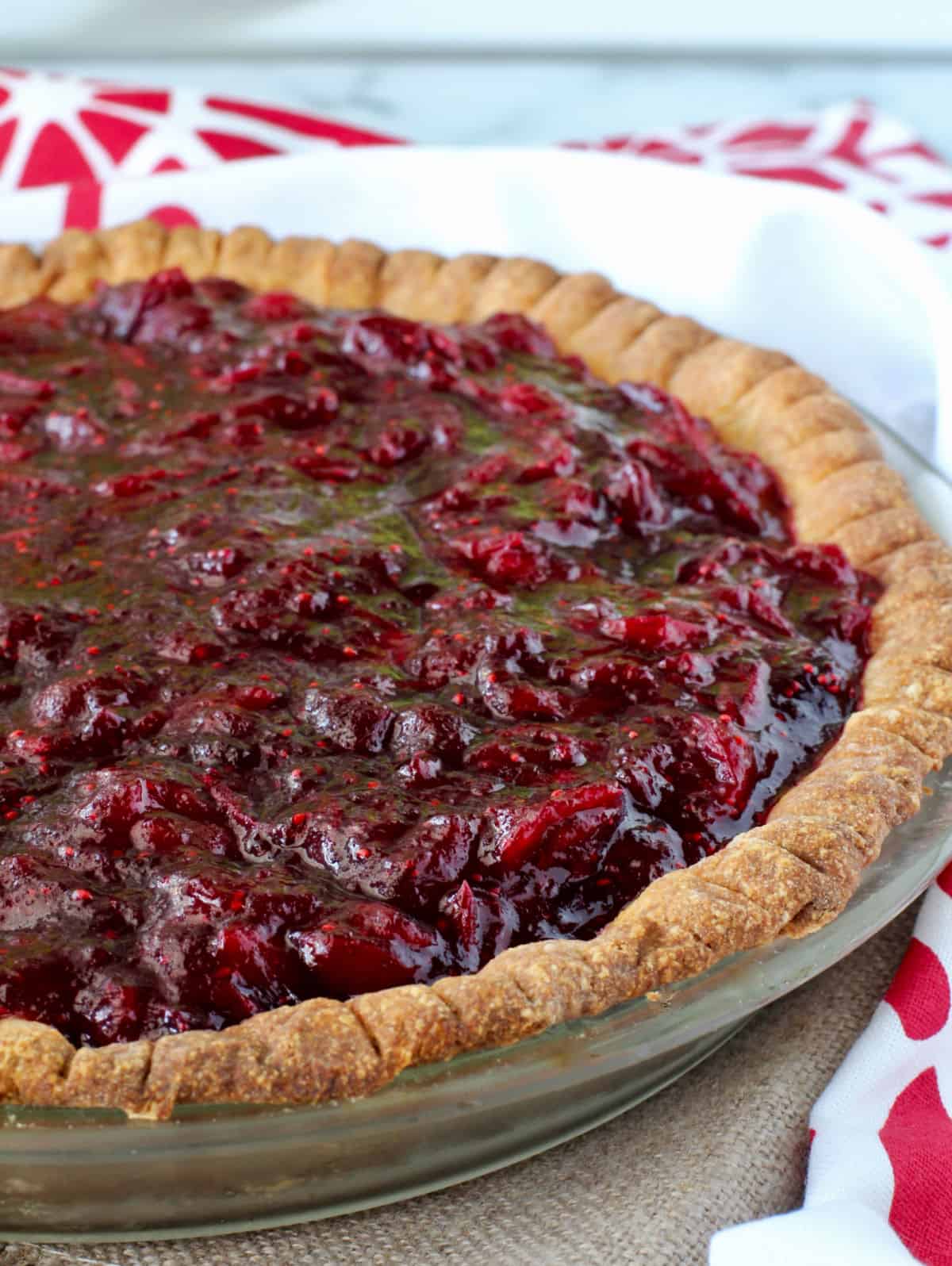 Whole Cranberry and Fudge Layered Pie in pie pan.
