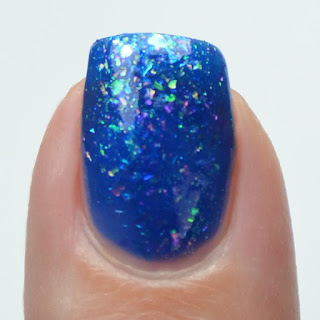 blue jelly nail polish with shifting flakies