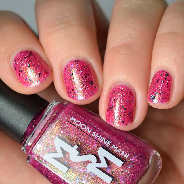 magenta nail polish with shimmer and flakies swatch