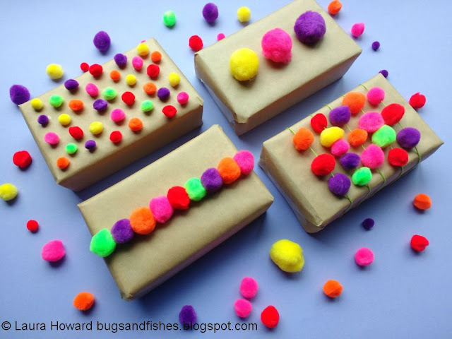 Brown paper parcels decorated with colourful pompoms