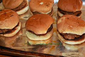 this is a delicious homemade sausage and how to make homemade sausage on a slider bun. The sandwich is on aluminum foil for easy reheating with mushrooms, a sausage pattie and slider bun