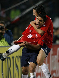 Chile's players celebrating another goal as they crush Colombia 4-0 at home