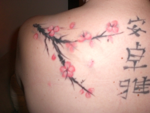 Though seemingly fragile and womanly cherry flower tattoo designs create a 