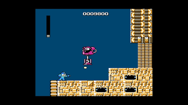 Mega Man ampumassa iso robottia
