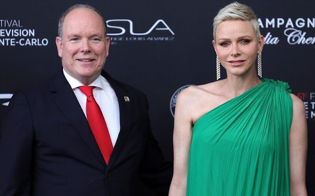 Princess Charlene wore a green flared-hem one-shoulder maxi dress by Lanvin Paris. Diamond earrings and dior sandals