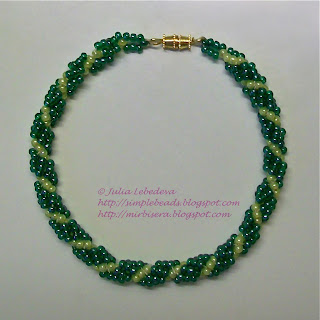 A bracelet of beaded spiral rope in green colors