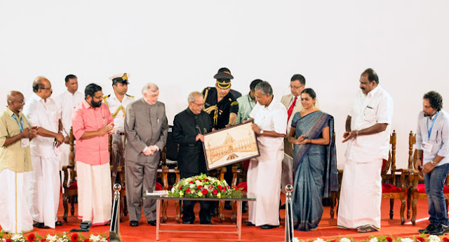  Chief Minister  Pinarayi Vijayan presenting a memento to President Pranab Mukherjee during the latter's visit to Kochi Biennale for inaugurating a seminar.Kerala Governor Chief Justice (Retd) Shri  P Sathasivam ,Prof K V Thomas MP,Minister for Tourism Shri Kadakampally Surendran, Kochi Corporation Mayor Smt Soumini Jain, Shri K J Maxi MLA,Kochi Biennale founders Bose Krishnamachari and Riyas Komu were among the dignitaries.